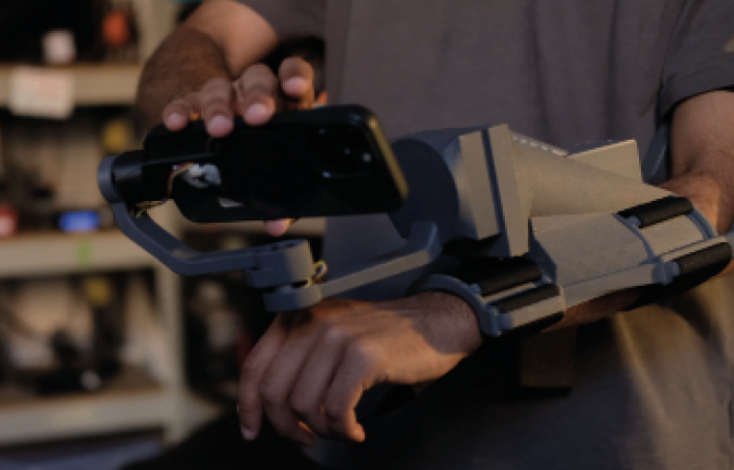 alta arm strapped to a user's forearm, ergonomic grip housing